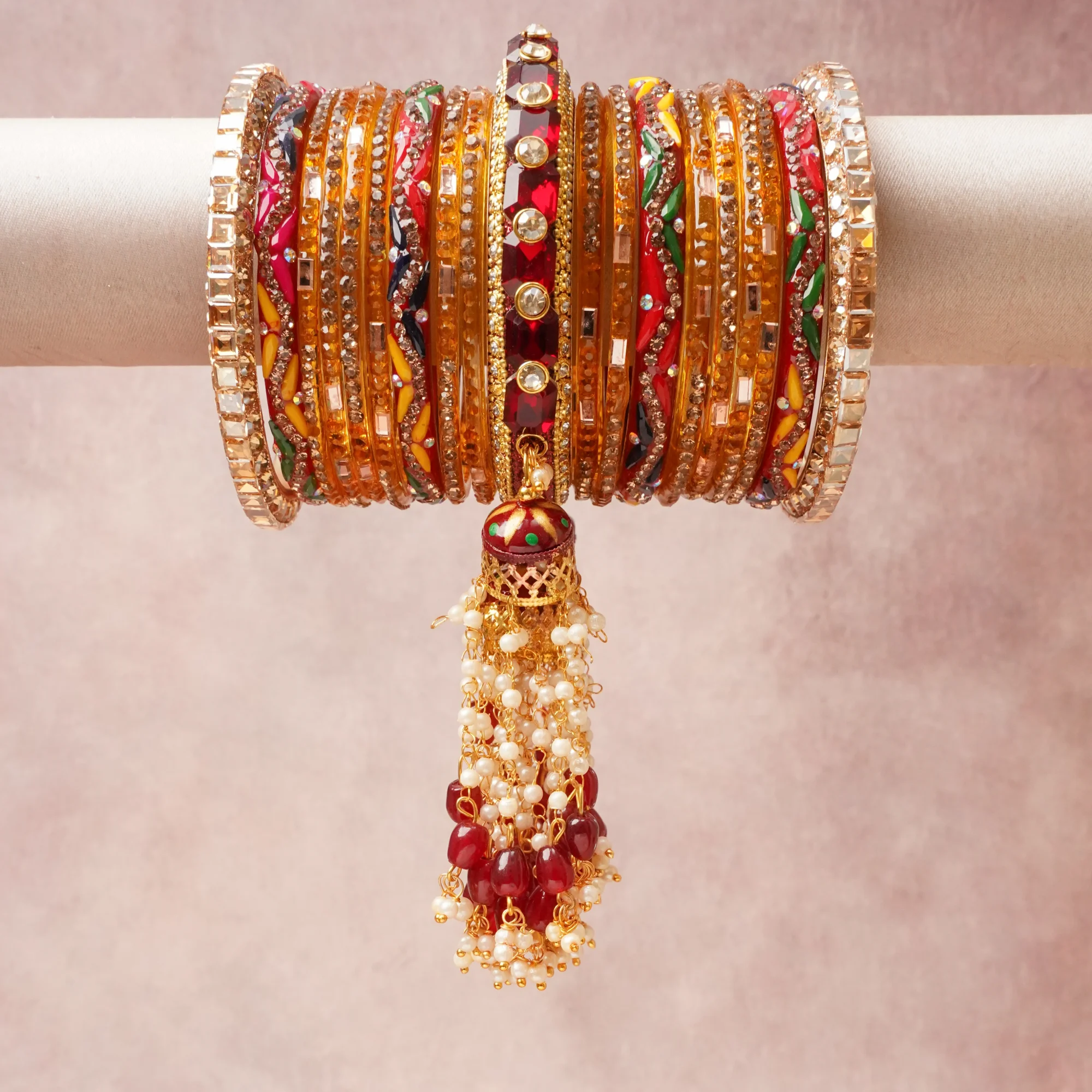 A commanding Multi colour anchors this beautiful set, enriched with accents of Emerald Green, Bright Yellow, Fuchsia, Cobalt Blue, Cream White, Clear Crystal, Mirror Silver that add depth and dimension.

Featuring a striking composition of Gold-plated Metal Alloy, Glass (Clear, Colored), Lacquer Enamel, Faceted Rhinestone, Kundan/Mirror Shards, Cultured Pearl/Imitation Pearl, Red Agate/Glass Bead, Textile Thread, this set carries intricate craftsmanship and strong presence. Grand in form, it is created for moments that deserve to be marked.